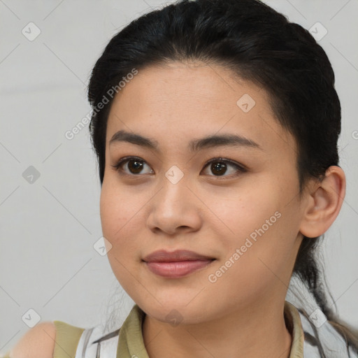 Joyful latino young-adult female with medium  black hair and brown eyes