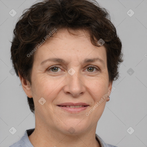 Joyful white adult female with short  brown hair and brown eyes