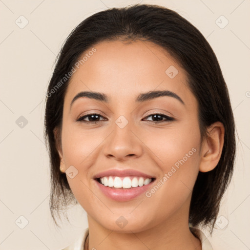 Joyful latino young-adult female with medium  brown hair and brown eyes