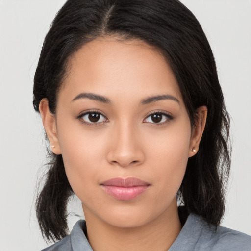 Joyful white young-adult female with medium  black hair and brown eyes