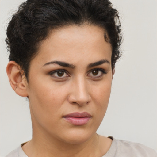 Neutral white young-adult female with short  brown hair and brown eyes