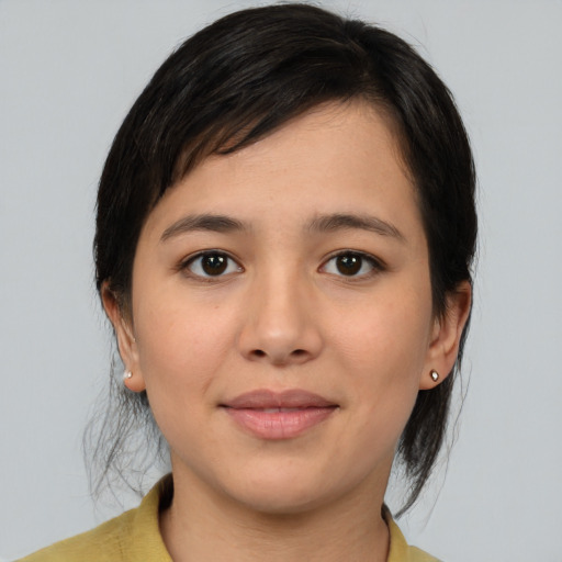 Joyful asian young-adult female with medium  brown hair and brown eyes