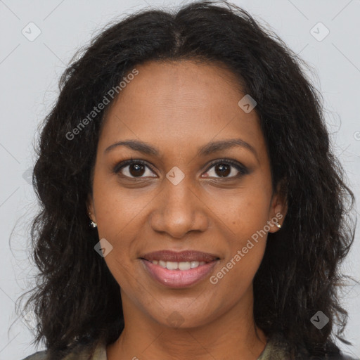 Joyful black adult female with long  brown hair and brown eyes