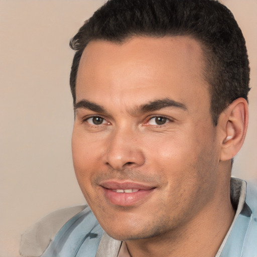 Joyful white young-adult male with short  black hair and brown eyes