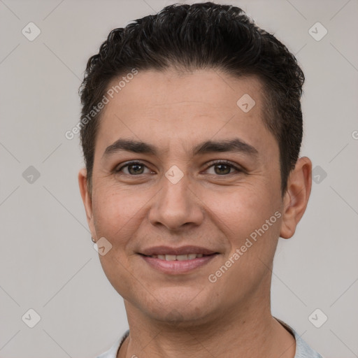 Joyful white young-adult male with short  brown hair and brown eyes