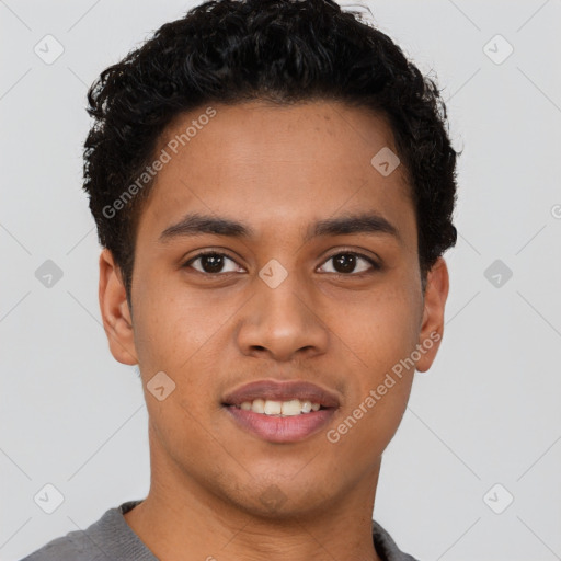 Joyful latino young-adult male with short  brown hair and brown eyes