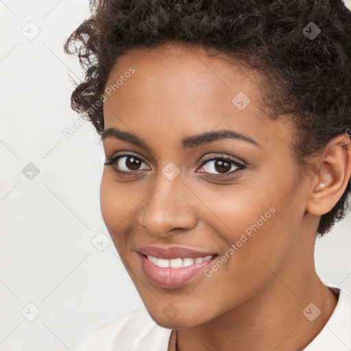 Joyful latino young-adult female with short  brown hair and brown eyes