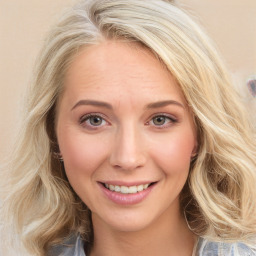 Joyful white young-adult female with medium  brown hair and blue eyes