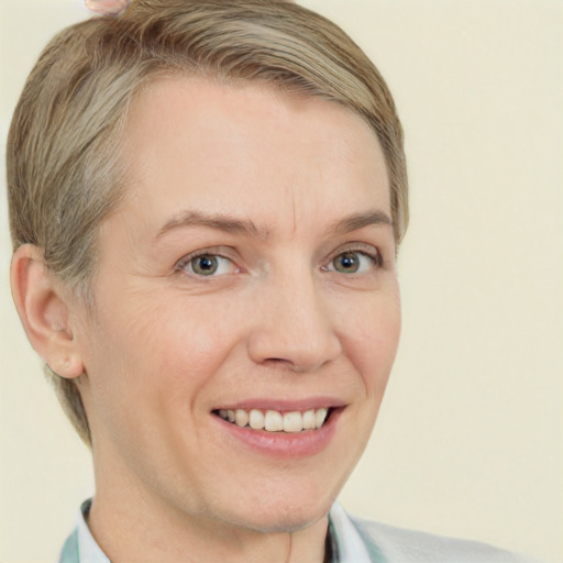 Joyful white adult female with short  brown hair and grey eyes