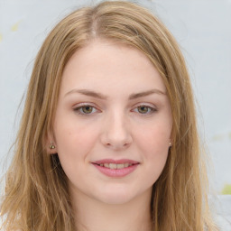 Joyful white young-adult female with long  brown hair and green eyes