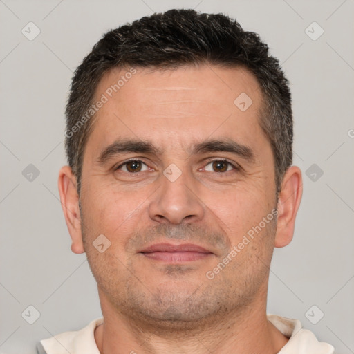 Joyful white adult male with short  brown hair and brown eyes