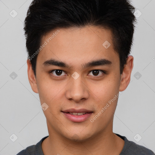 Joyful asian young-adult male with short  brown hair and brown eyes