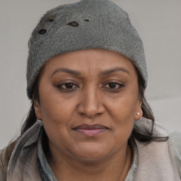 Joyful latino adult female with short  brown hair and brown eyes