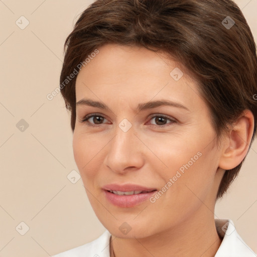 Joyful white young-adult female with short  brown hair and brown eyes