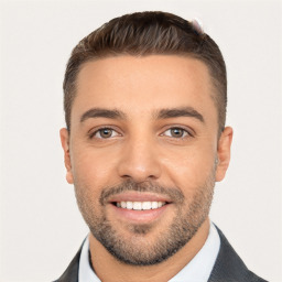 Joyful white young-adult male with short  brown hair and brown eyes