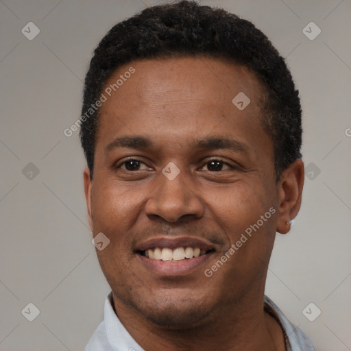 Joyful latino young-adult male with short  black hair and brown eyes