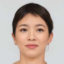 Neutral asian young-adult female with medium  brown hair and brown eyes