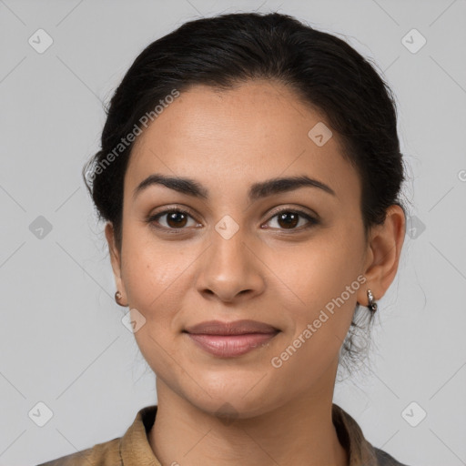 Joyful latino young-adult female with medium  brown hair and brown eyes