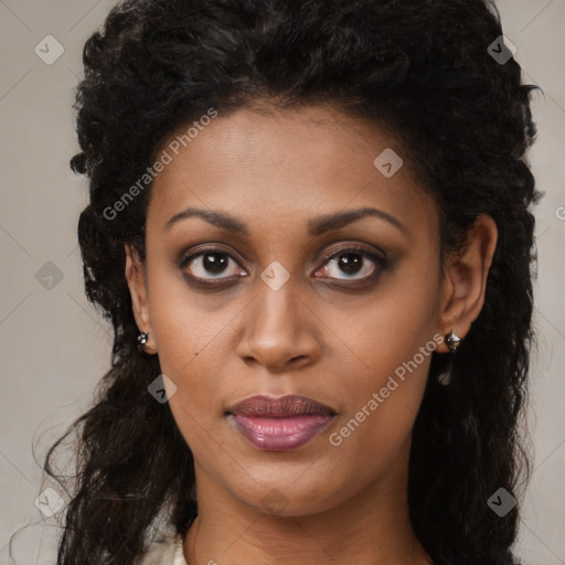 Joyful black young-adult female with long  black hair and brown eyes