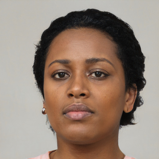 Neutral black young-adult female with medium  black hair and brown eyes