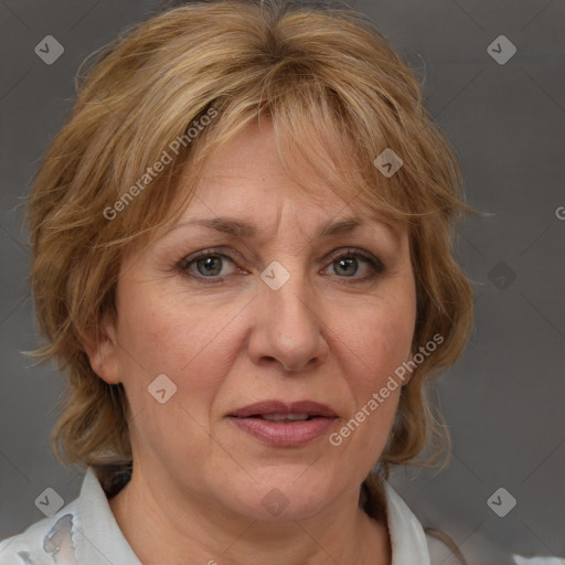 Joyful white adult female with medium  brown hair and blue eyes