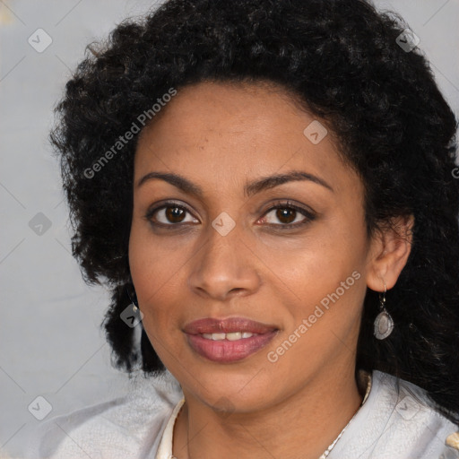 Joyful black young-adult female with long  brown hair and brown eyes