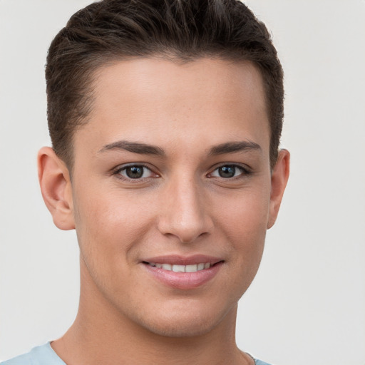 Joyful white young-adult female with short  brown hair and brown eyes