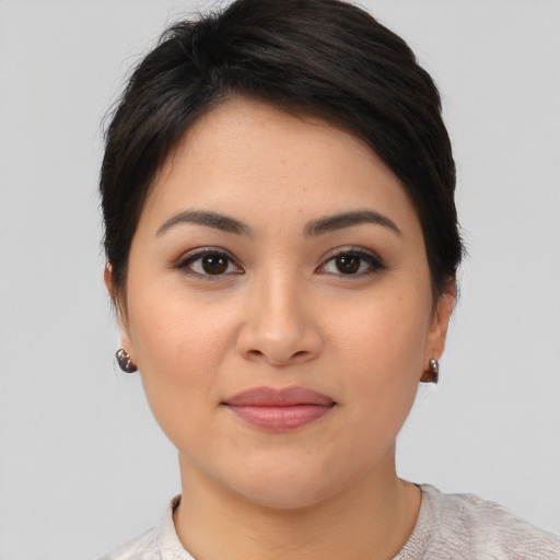 Joyful asian young-adult female with medium  brown hair and brown eyes
