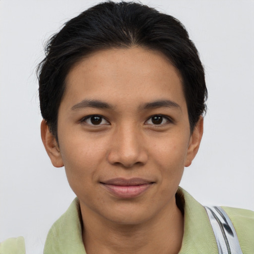 Joyful asian young-adult female with short  brown hair and brown eyes