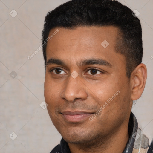 Joyful latino young-adult male with short  black hair and brown eyes