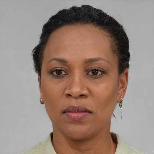 Neutral black adult female with short  black hair and brown eyes