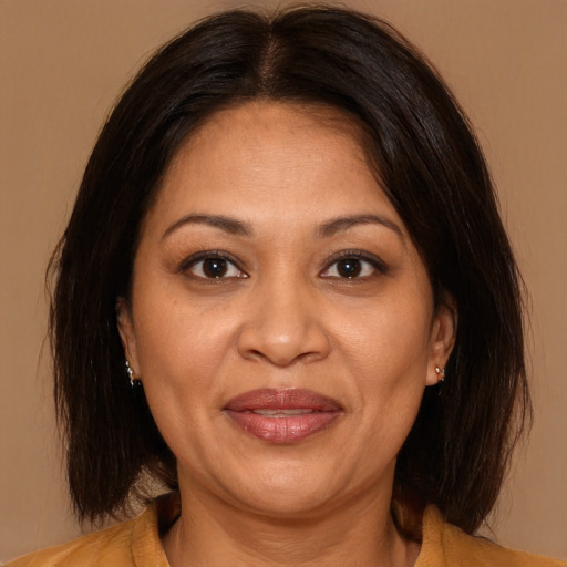 Joyful white adult female with medium  brown hair and brown eyes