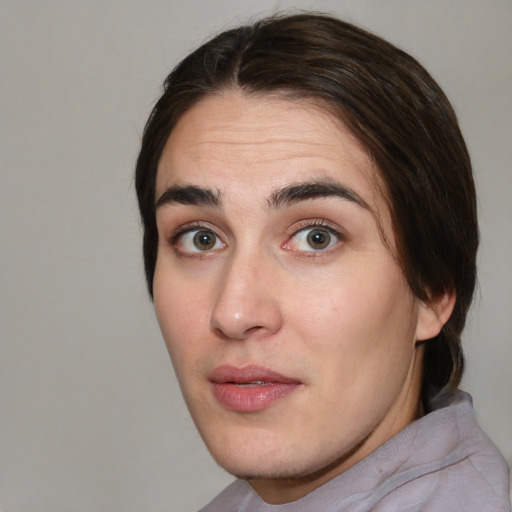 Joyful white young-adult female with medium  brown hair and brown eyes