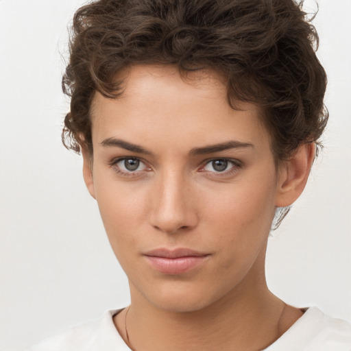 Neutral white young-adult female with short  brown hair and brown eyes