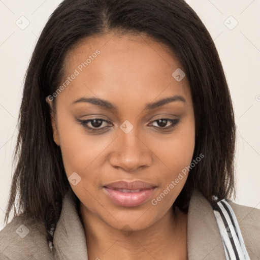 Joyful black young-adult female with long  brown hair and brown eyes