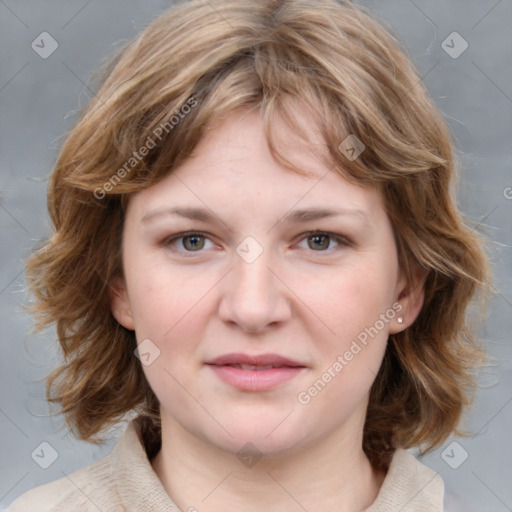 Joyful white young-adult female with medium  brown hair and blue eyes