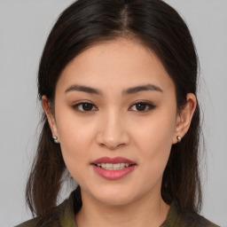 Joyful asian young-adult female with long  brown hair and brown eyes