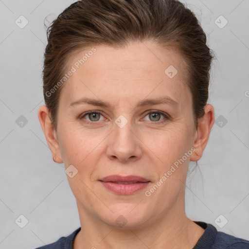 Joyful white adult female with short  brown hair and grey eyes