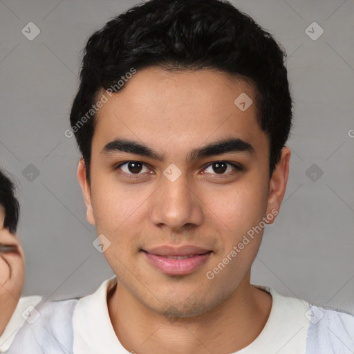 Joyful asian young-adult male with short  black hair and brown eyes