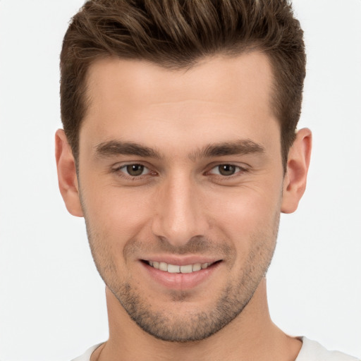 Joyful white young-adult male with short  brown hair and brown eyes