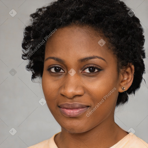 Joyful black young-adult female with medium  black hair and brown eyes