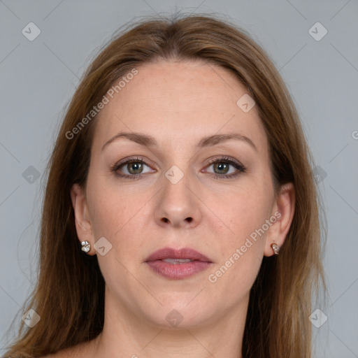 Joyful white adult female with long  brown hair and grey eyes