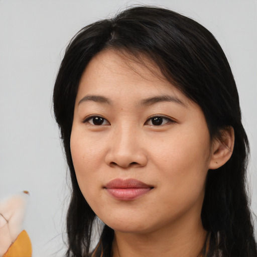 Joyful asian young-adult female with medium  black hair and brown eyes
