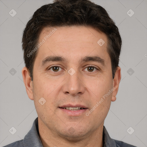 Joyful white adult male with short  brown hair and brown eyes