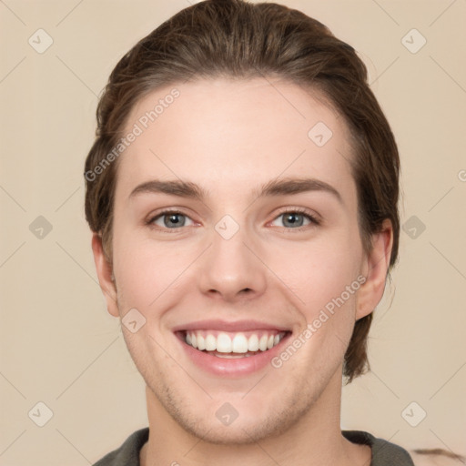 Joyful white young-adult female with short  brown hair and grey eyes