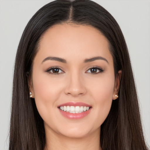 Joyful white young-adult female with long  black hair and brown eyes