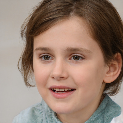 Joyful white child female with medium  brown hair and brown eyes