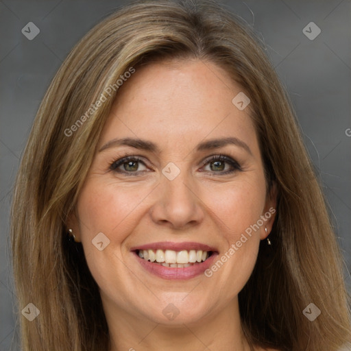 Joyful white adult female with long  brown hair and grey eyes