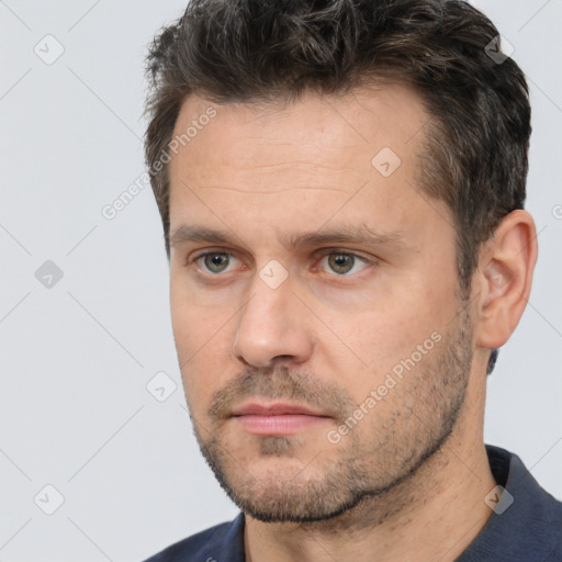 Neutral white adult male with short  brown hair and brown eyes