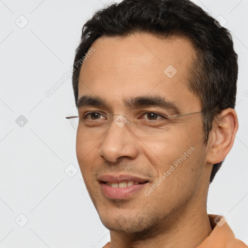 Joyful white young-adult male with short  black hair and brown eyes